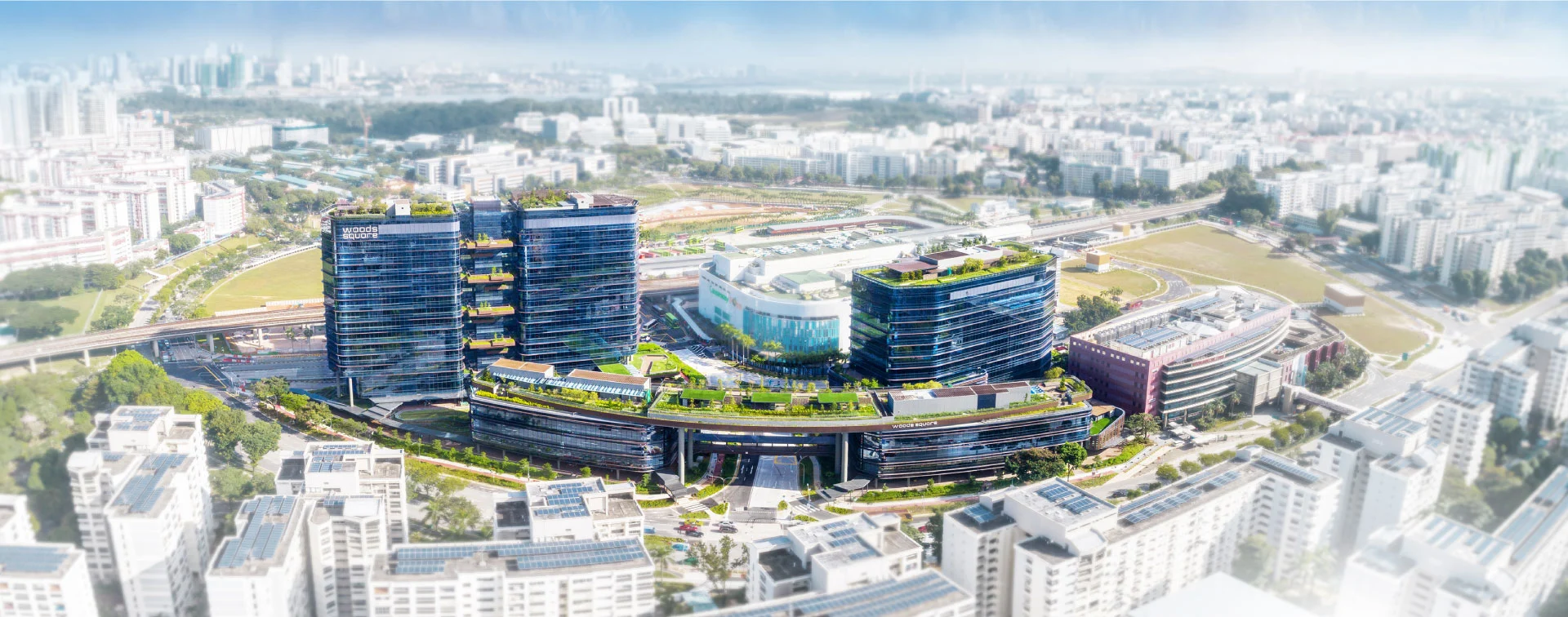 High aerial view of Woods Square integrated within Woodlands Regional Centre masterplan, Singapore