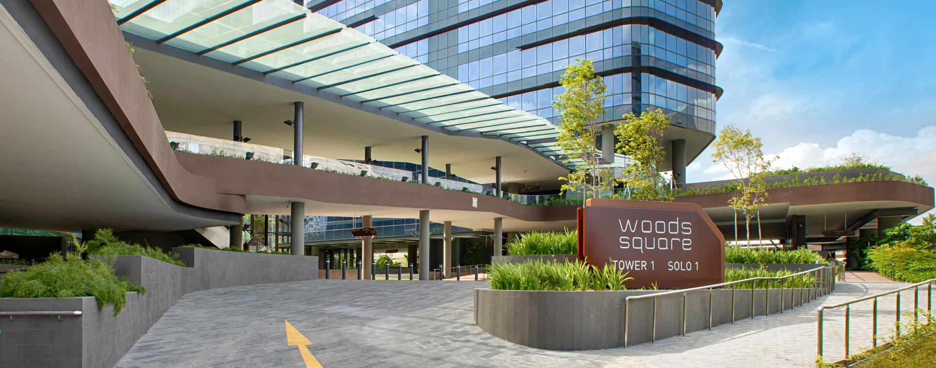 Woods Square entrance with Tower 1 and SOLO 1 signage, Woodlands Square Singapore