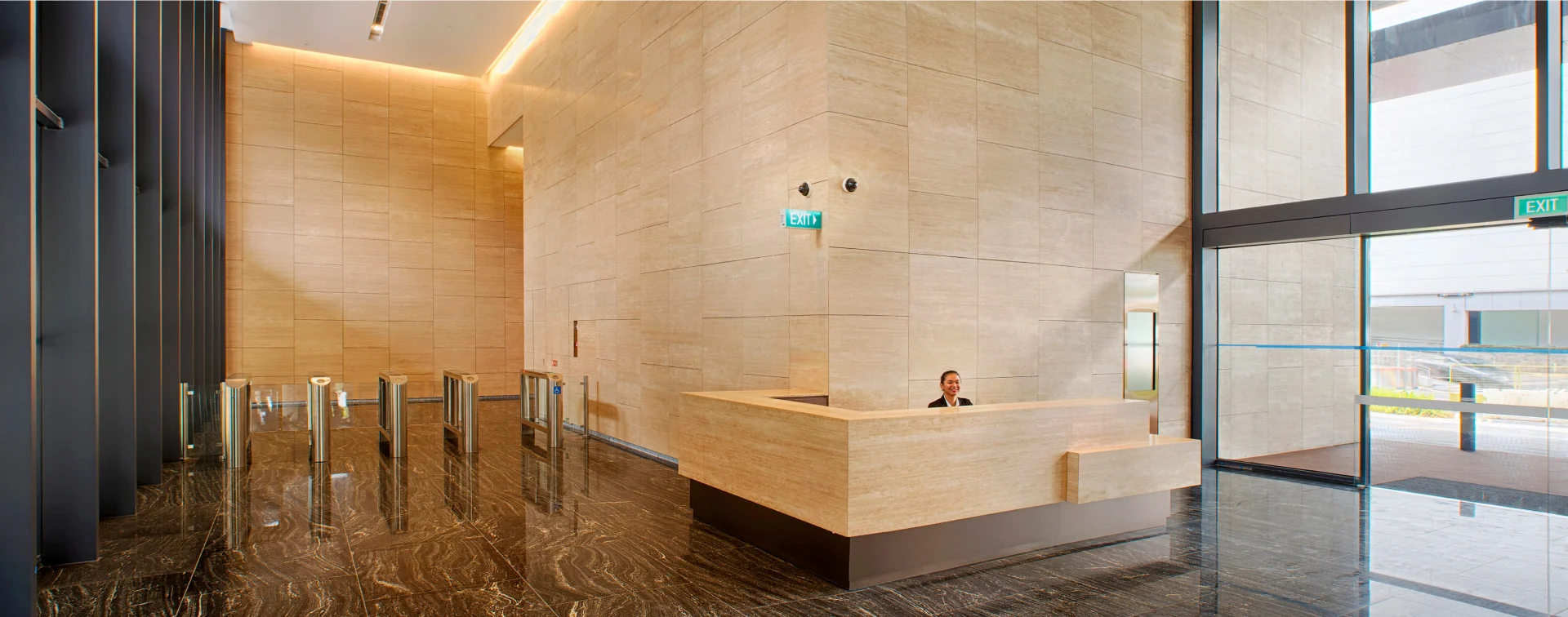 Woods Square Grade-A lobby with marble reception and 24/7 security concierge